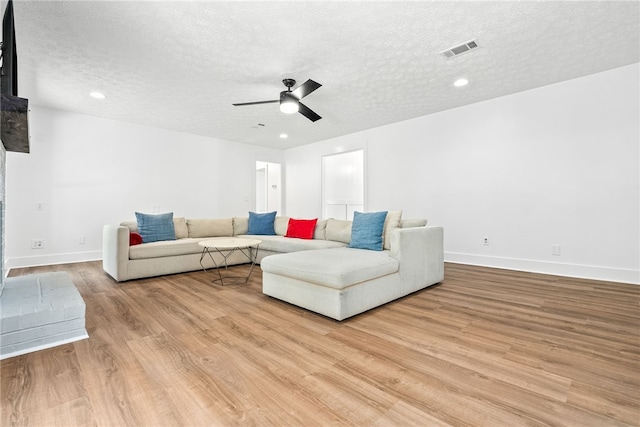 322 Cricket Ln, Auburn, AL 36832 - living room with light wood-type flooring, a ceiling fan, a textured ceiling, and recessed lighting