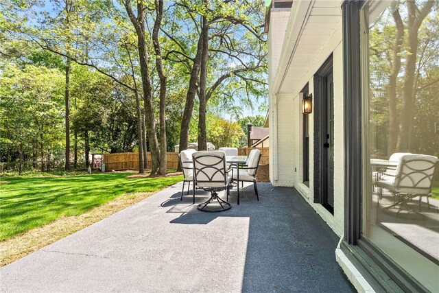 322 Cricket Ln, Auburn, AL 36832 - view of patio featuring outdoor dining space and view of scattered trees