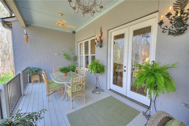 wooden terrace with ceiling fan and french doors