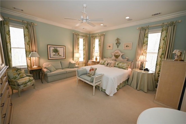 bedroom featuring ceiling fan, crown molding, and light carpet