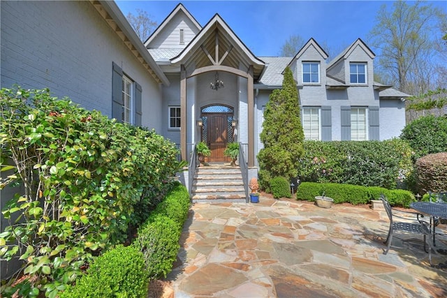 doorway to property featuring a patio