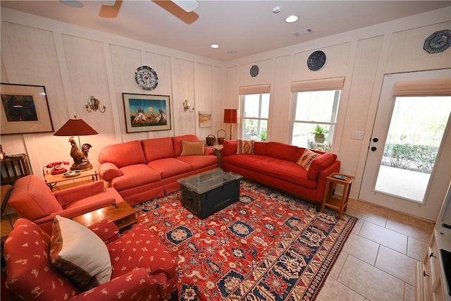 tiled living room featuring ceiling fan