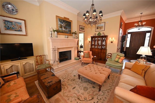 living room with crown molding, an inviting chandelier, and hardwood / wood-style flooring