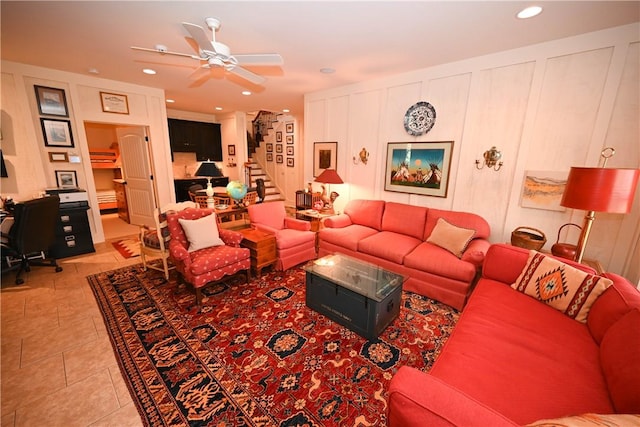 tiled living room with ceiling fan