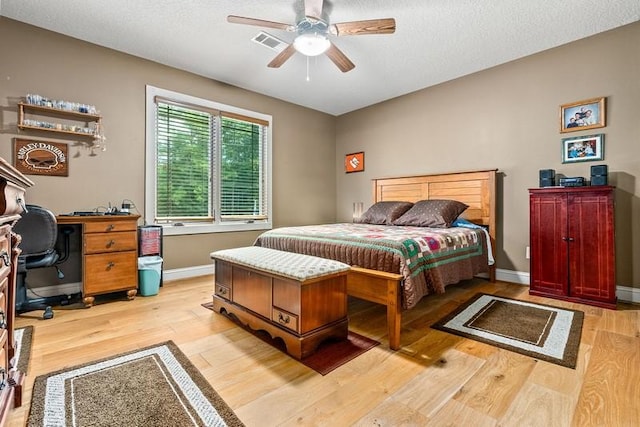 14699 Lee Road 188, Waverly, AL 36879 - bedroom with light wood-style floors, visible vents, baseboards, and a textured ceiling