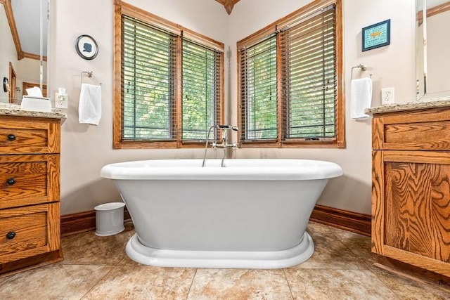 14699 Lee Road 188, Waverly, AL 36879 - bathroom with a freestanding tub, vanity, and baseboards