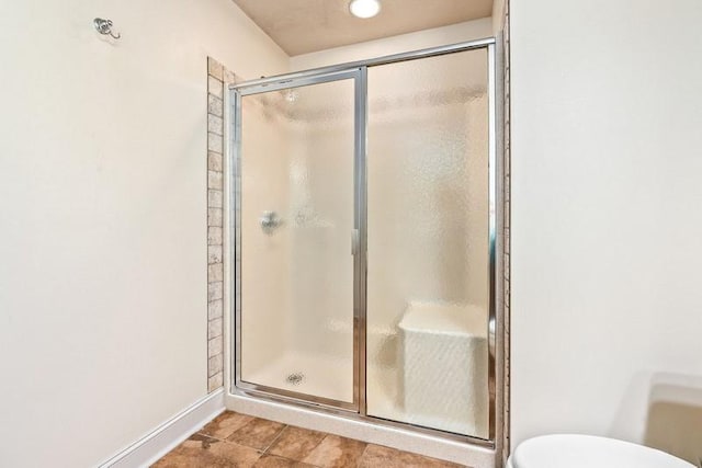 14699 Lee Road 188, Waverly, AL 36879 - full bathroom with a stall shower, baseboards, toilet, and tile patterned floors