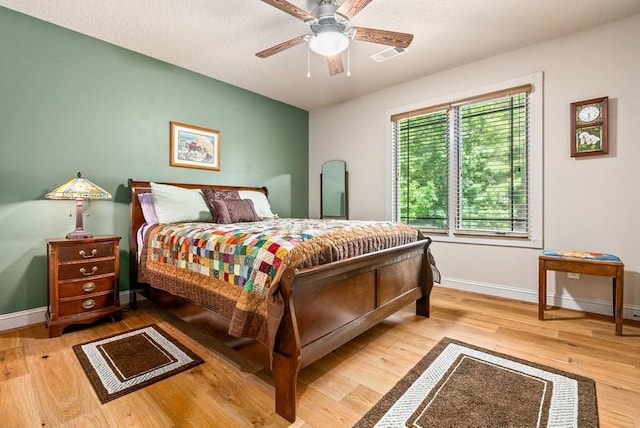 14699 Lee Road 188, Waverly, AL 36879 - bedroom with a ceiling fan, wood finished floors, visible vents, and baseboards