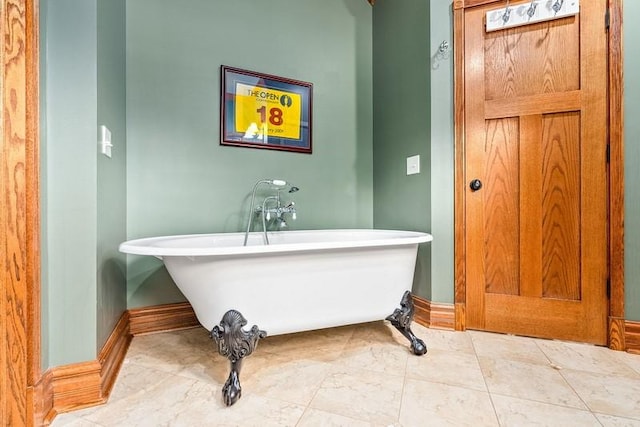 14699 Lee Road 188, Waverly, AL 36879 - bathroom featuring a freestanding bath and baseboards