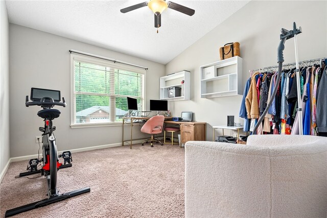 office area with carpet, vaulted ceiling, baseboards, a textured ceiling, and ceiling fan