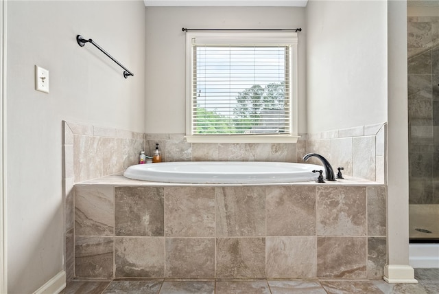 bathroom featuring plenty of natural light and a garden tub
