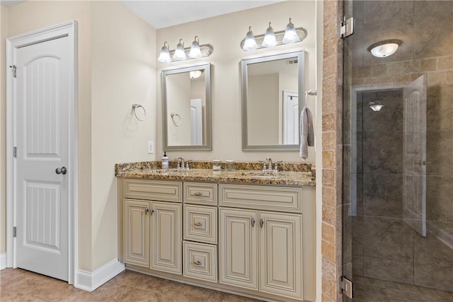 661 Deer Run Rd, Auburn, AL 36832 - bathroom featuring double vanity, a stall shower, tile patterned floors, and baseboards