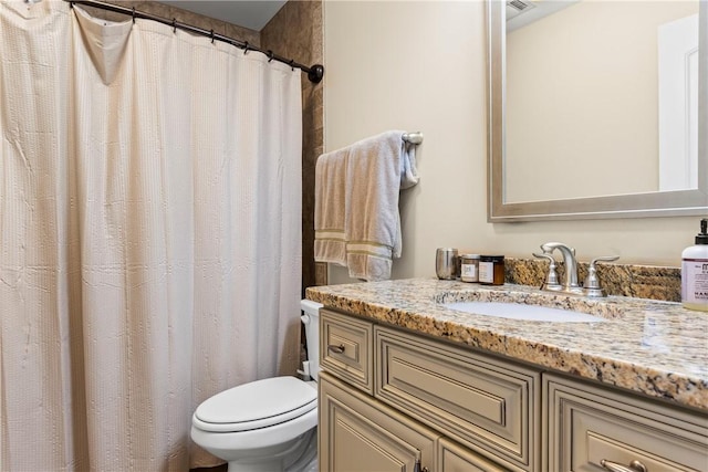 661 Deer Run Rd, Auburn, AL 36832 - bathroom featuring vanity, toilet, and a shower with shower curtain