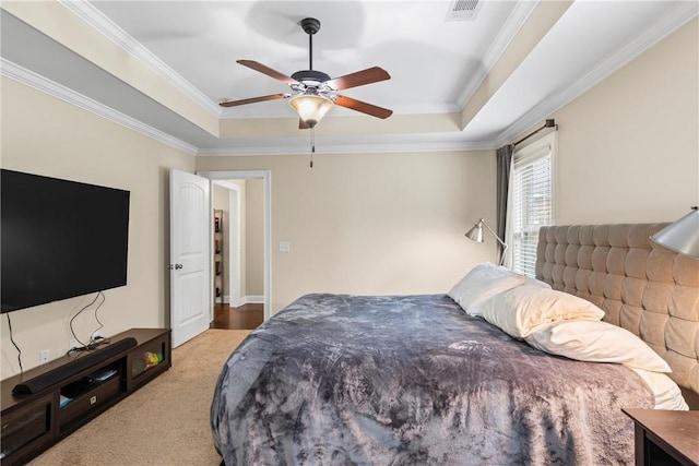 661 Deer Run Rd, Auburn, AL 36832 - bedroom featuring a raised ceiling, crown molding, light carpet, and a ceiling fan