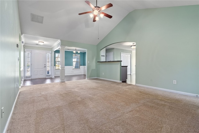 unfurnished living room featuring visible vents, carpet floors, ceiling fan, and decorative columns