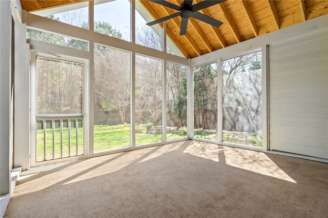 unfurnished sunroom featuring wooden ceiling, a ceiling fan, and vaulted ceiling