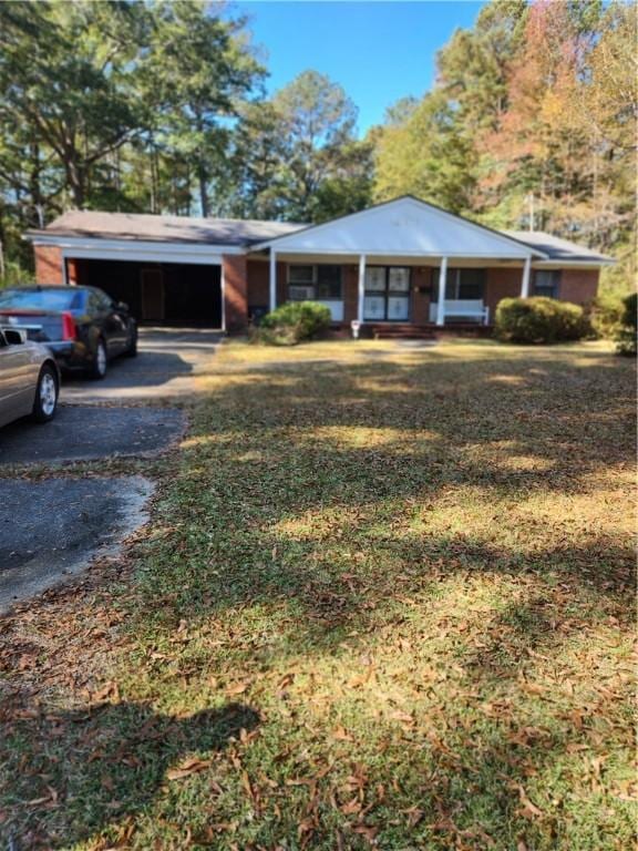 single story home with covered porch