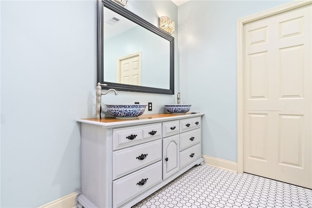 1806 Bluestone Ct, Auburn, AL 36830 - bathroom featuring baseboards and double vanity