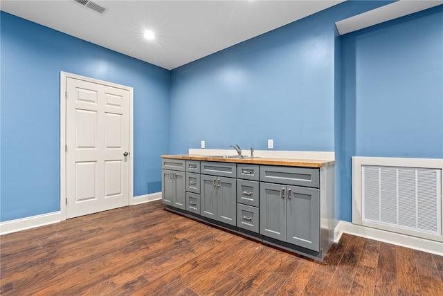 1806 Bluestone Ct, Auburn, AL 36830 - bar with dark wood-style floors, baseboards, a sink, and recessed lighting