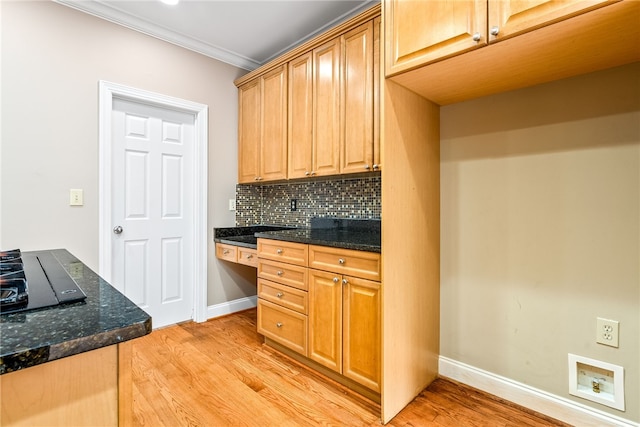 1806 Bluestone Ct, Auburn, AL 36830 - kitchen with light wood-type flooring, decorative backsplash, baseboards, dark stone counters, and ornamental molding