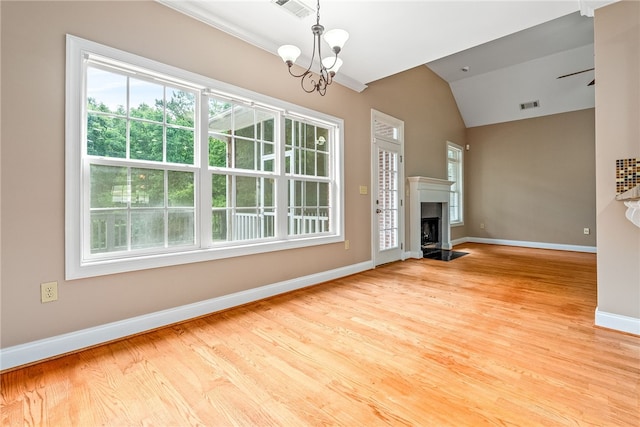 1806 Bluestone Ct, Auburn, AL 36830 - unfurnished living room with vaulted ceiling, a chandelier, baseboards, a fireplace, and wood finished floors