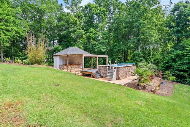 1806 Bluestone Ct, Auburn, AL 36830 - view of grassy yard with a wooden deck, a gazebo, and an outdoor pool