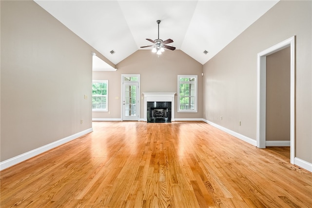 1806 Bluestone Ct, Auburn, AL 36830 - unfurnished living room featuring a ceiling fan, a high end fireplace, light wood-style flooring, lofted ceiling, and baseboards