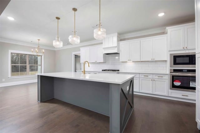 11884 Lee Road 188, Waverly, AL 36879 - kitchen with stainless steel appliances, decorative light fixtures, a center island with sink, and white cabinets
