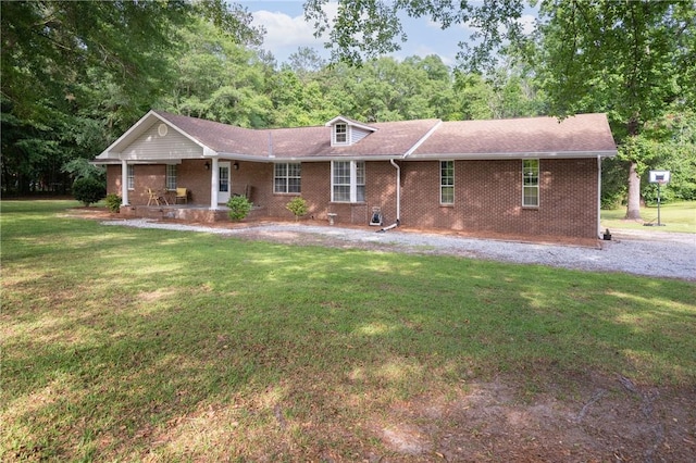 158 Lee Road 242, Phenix City, AL 36870 - ranch-style house featuring a front yard, brick siding, and covered porch