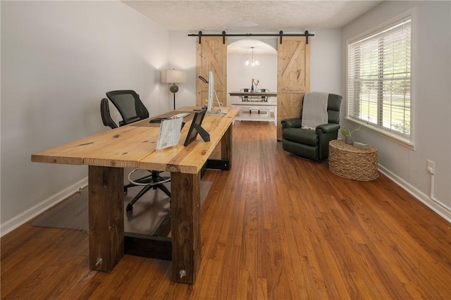 158 Lee Road 242, Phenix City, AL 36870 - office area with a barn door, baseboards, and wood finished floors