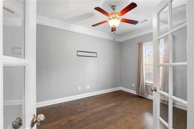 unfurnished room featuring ceiling fan, ornamental molding, and dark wood-type flooring