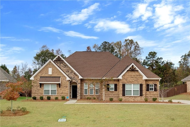 craftsman-style house with a front yard