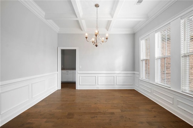 spare room featuring beamed ceiling, an inviting chandelier, dark wood-type flooring, and coffered ceiling