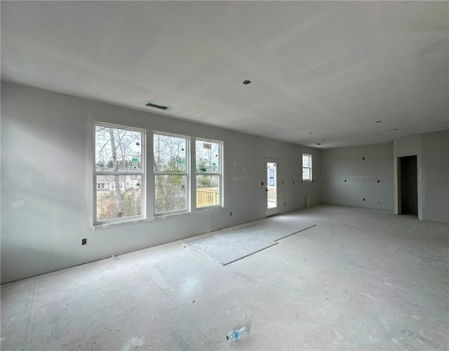 empty room featuring visible vents and plenty of natural light