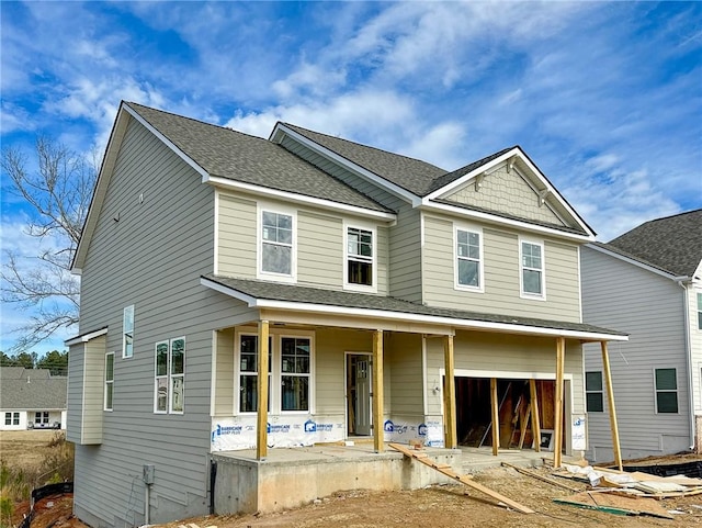 view of front of house with a garage and a porch