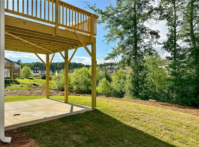 2248 Red Tail Ln, Auburn, AL 36879 - view of green lawn featuring a patio and a deck
