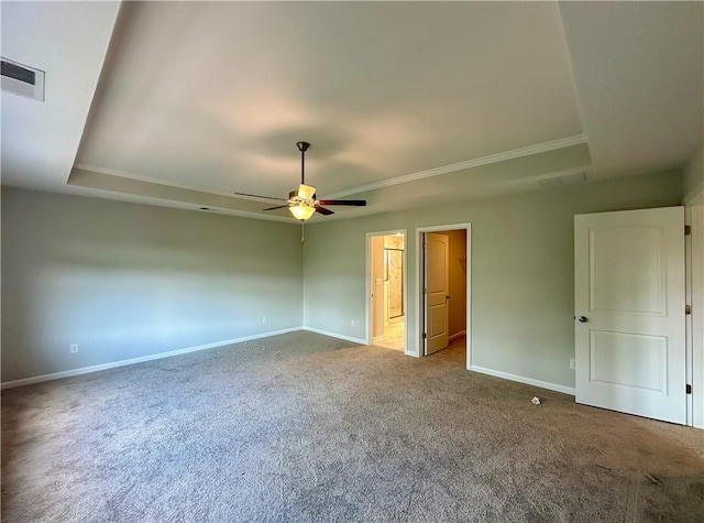 2248 Red Tail Ln, Auburn, AL 36879 - empty room featuring a raised ceiling, a ceiling fan, carpet flooring, baseboards, and crown molding