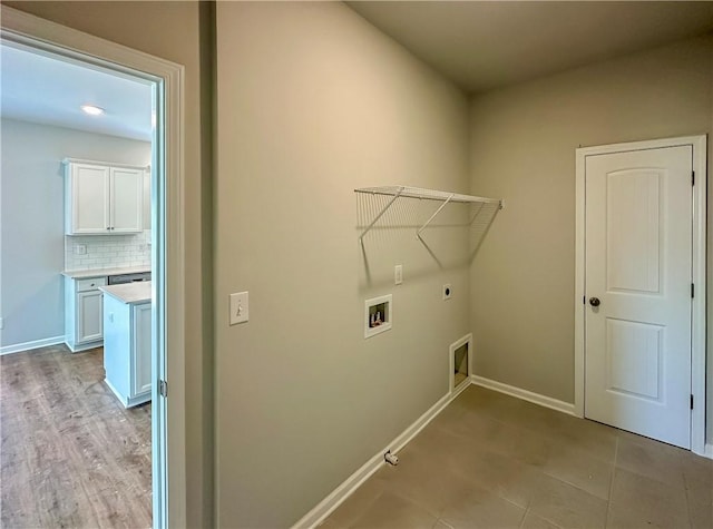 2248 Red Tail Ln, Auburn, AL 36879 - laundry area with hookup for an electric dryer, hookup for a washing machine, gas dryer hookup, and baseboards