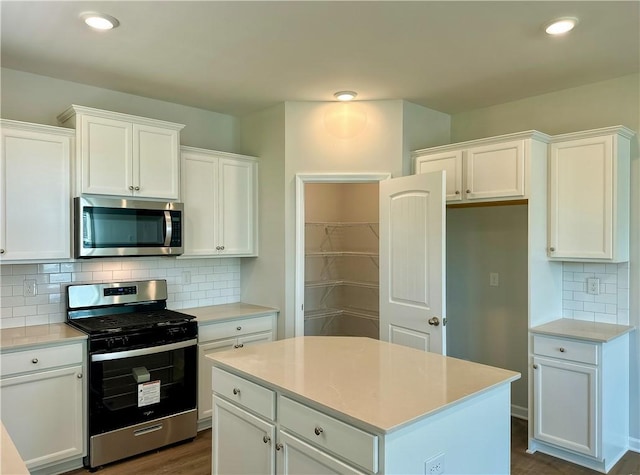 2248 Red Tail Ln, Auburn, AL 36879 - kitchen featuring appliances with stainless steel finishes, tasteful backsplash, white cabinets, light countertops, and recessed lighting