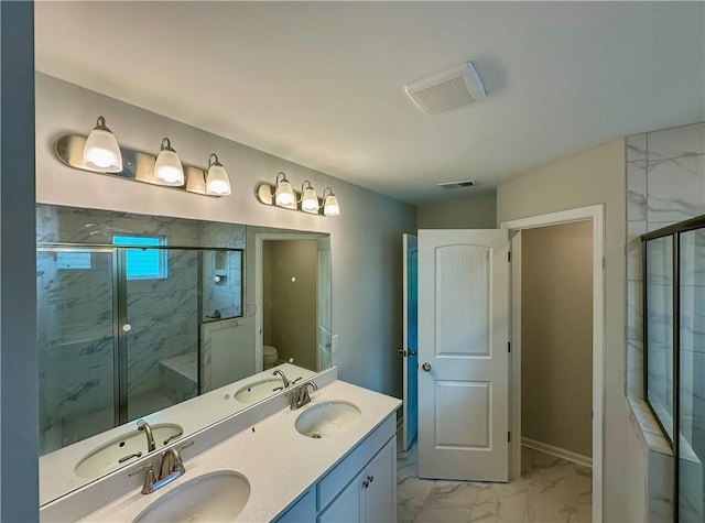 2248 Red Tail Ln, Auburn, AL 36879 - bathroom featuring marble finish floors, a marble finish shower, toilet, and double vanity
