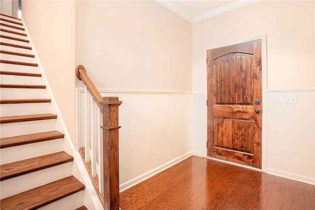 1931 Sequoia Dr, Auburn, AL 36879 - entrance foyer with wood finished floors, wainscoting, stairway, and crown molding