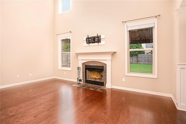 1931 Sequoia Dr, Auburn, AL 36879 - unfurnished living room featuring dark wood-style floors and a tiled fireplace