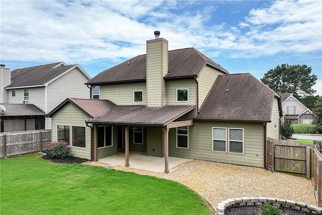 1931 Sequoia Dr, Auburn, AL 36879 - back of house featuring a patio area, a shingled roof, a fenced backyard, and a chimney