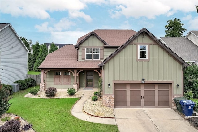 1931 Sequoia Dr, Auburn, AL 36879 - craftsman house with board and batten siding, a front lawn, concrete driveway, stone siding, and roof with shingles