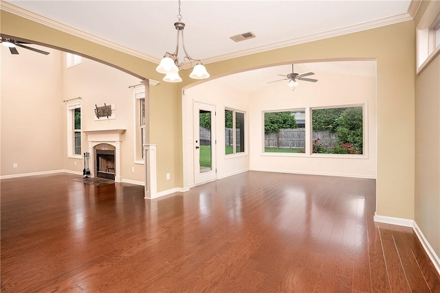 1931 Sequoia Dr, Auburn, AL 36879 - unfurnished living room featuring a ceiling fan, healthy amount of natural light, dark wood-style floors, a fireplace with flush hearth, and crown molding