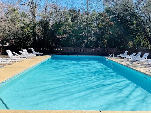 view of pool featuring a fenced in pool, a patio area, and fence