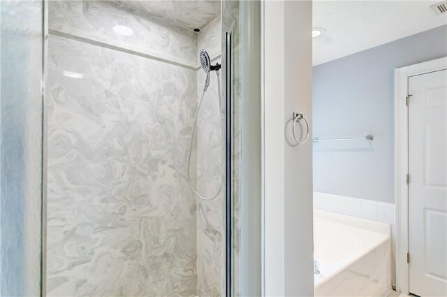 2331 Morgan Dr, Auburn, AL 36830 - bathroom featuring a marble finish shower and a garden tub