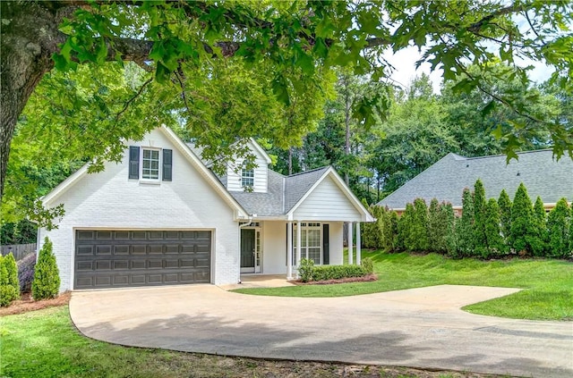2331 Morgan Dr, Auburn, AL 36830 - traditional home with driveway, a front lawn, covered porch, roof with shingles, and an attached garage