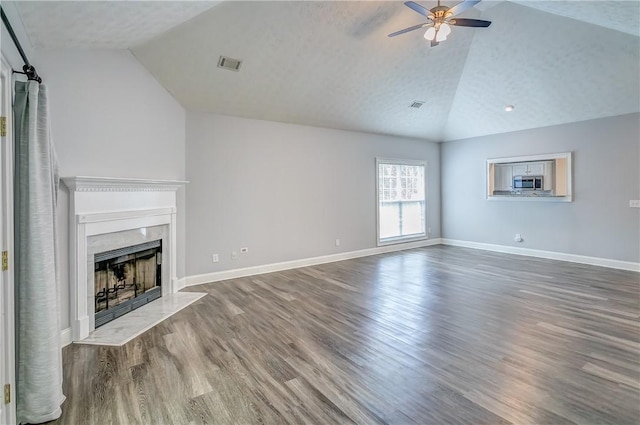 2331 Morgan Dr, Auburn, AL 36830 - unfurnished living room featuring lofted ceiling, wood finished floors, ceiling fan, and a premium fireplace