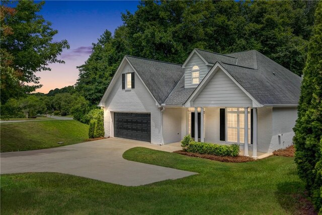 2331 Morgan Dr, Auburn, AL 36830 - view of front of property with brick siding, concrete driveway, a lawn, and a garage